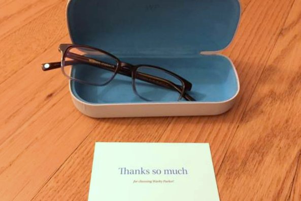 Warby Parker glasses.